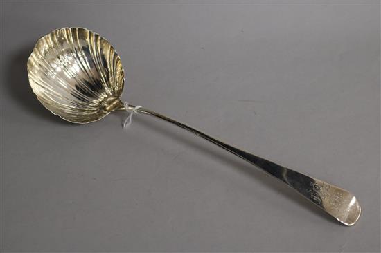 A George III silver Old English pattern scallop bowl soup ladle, 31cm.